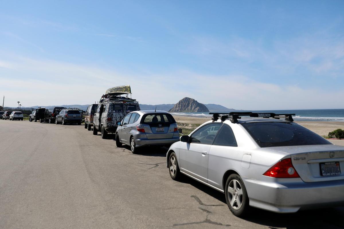 The parking lot at Morro Strand State Beach is closed, so cars parked along Beachcomber Drive.