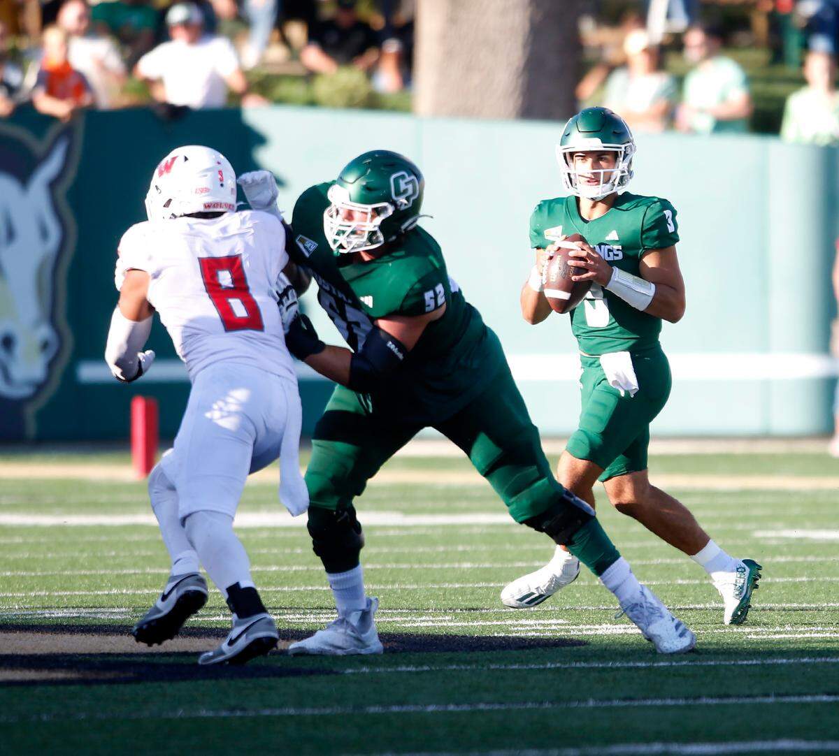 Mustang quarterback Bo Kelly looks to pass as Cal Poly SLO football beat Western Oregon 31-14 at Mustang Memorial Field on Sept. 14, 2024.