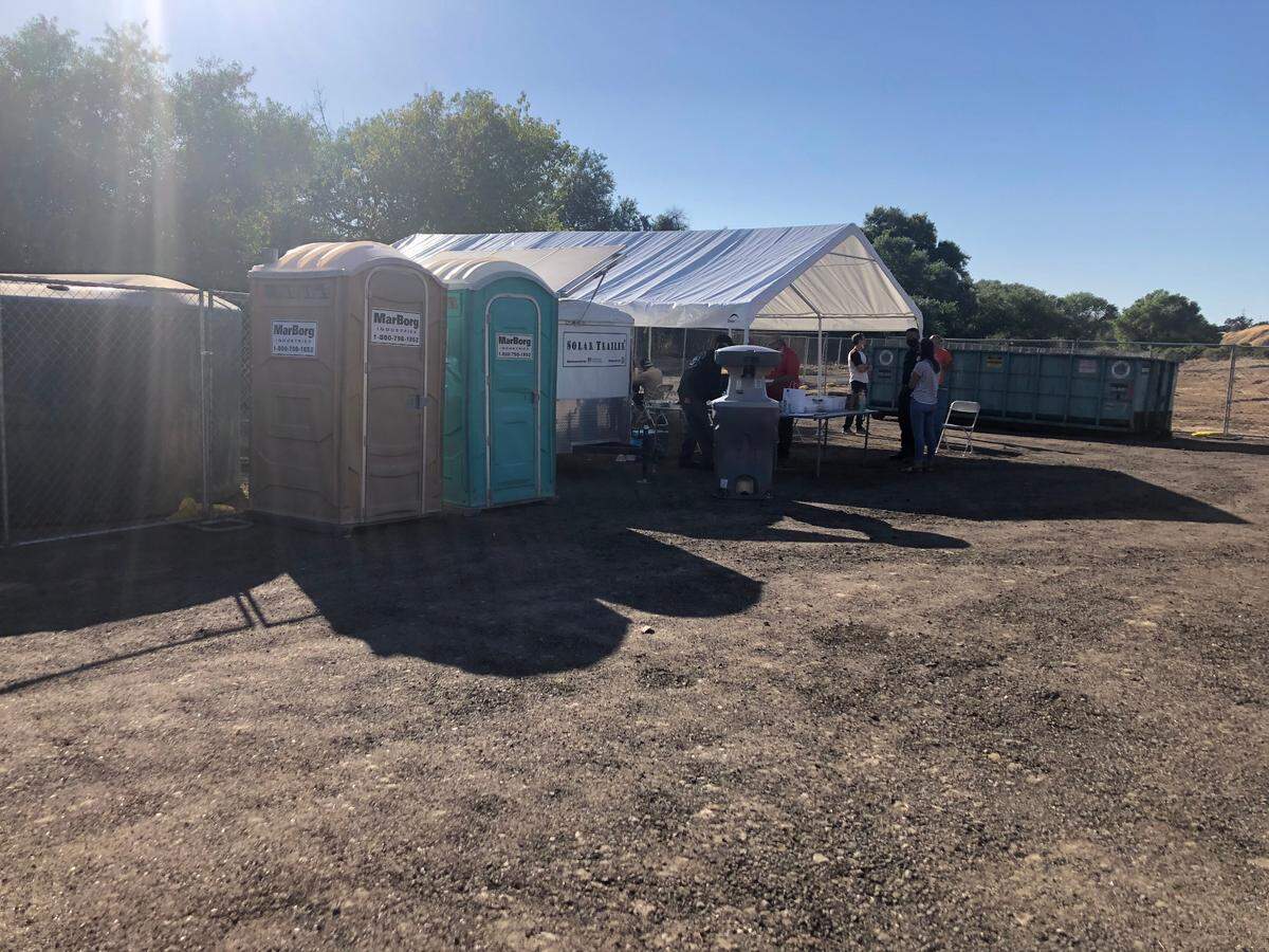 Paso Robles has set up portable toilets, a hand-washing station and a tent for nightly meals at a temporary homeless camp the city recently built at the Borkey Flats site off River Road north of the 24th Street Bridge. The city created the camp so leaders could clean up makeshift shelters in the Salinas Riverbed, which they say pose a fire risk.