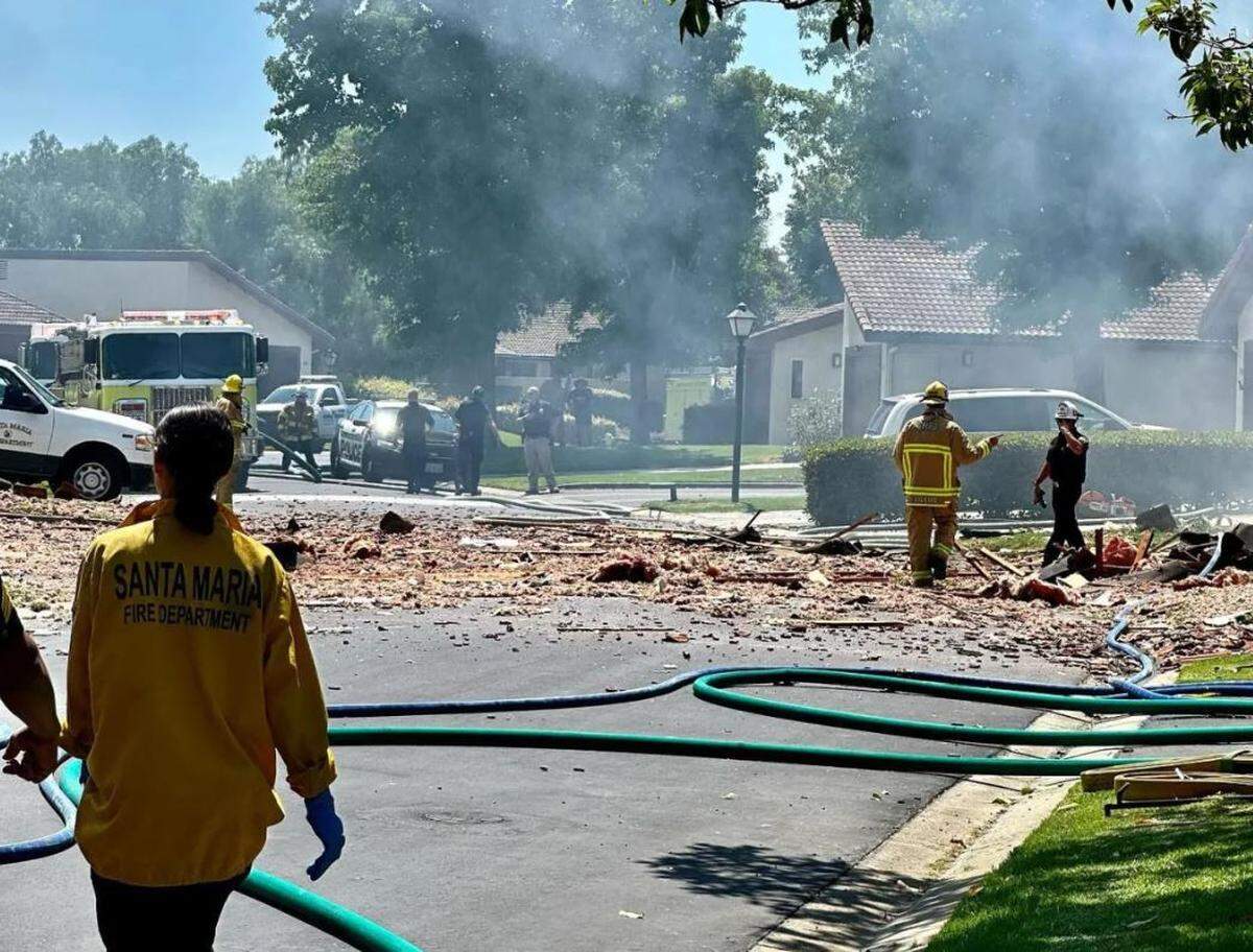 Debris and smoke in the aftermath of an explosion and fire in Santa Maria Wednesday.