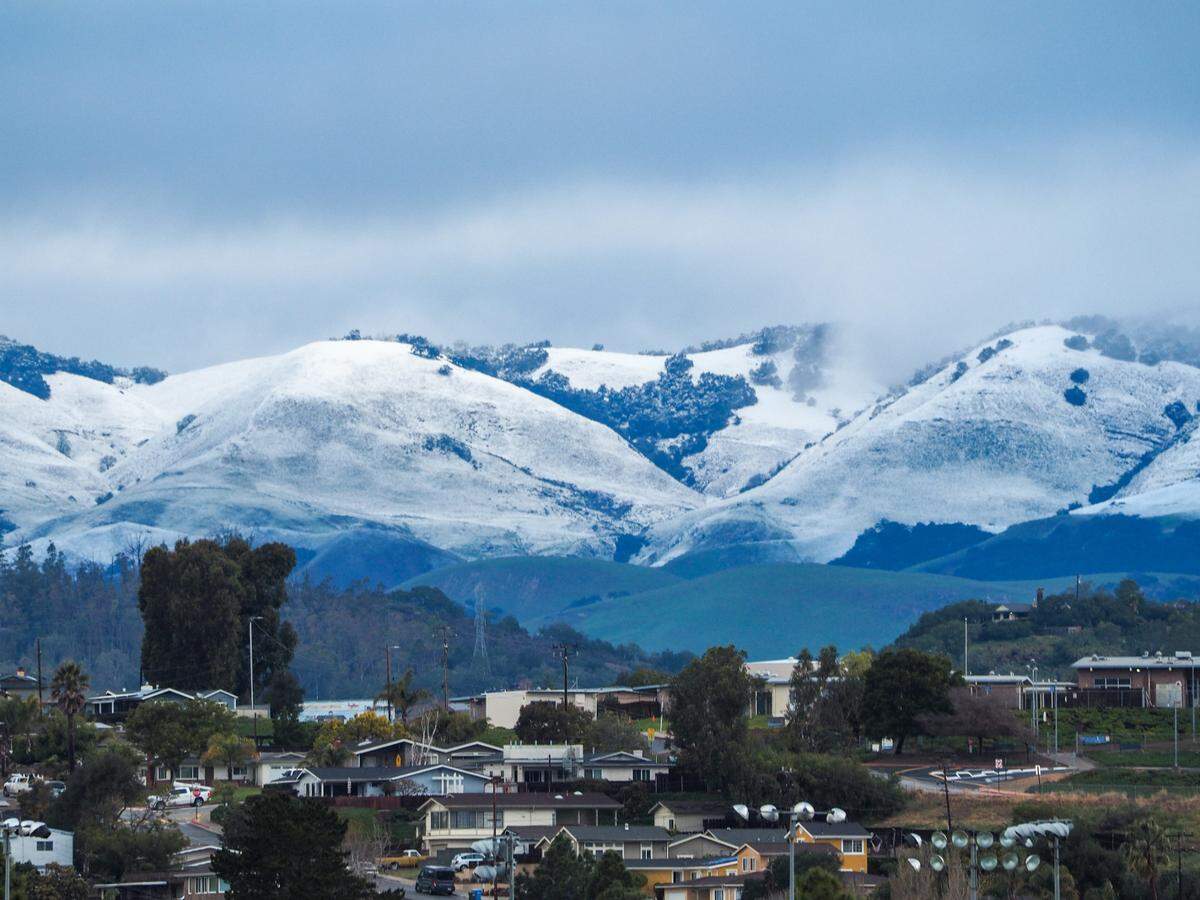 Snow dusts the hills in south San Luis Obispo County in a view from Grover Beach on Saturday, Feb. 25, 2023.