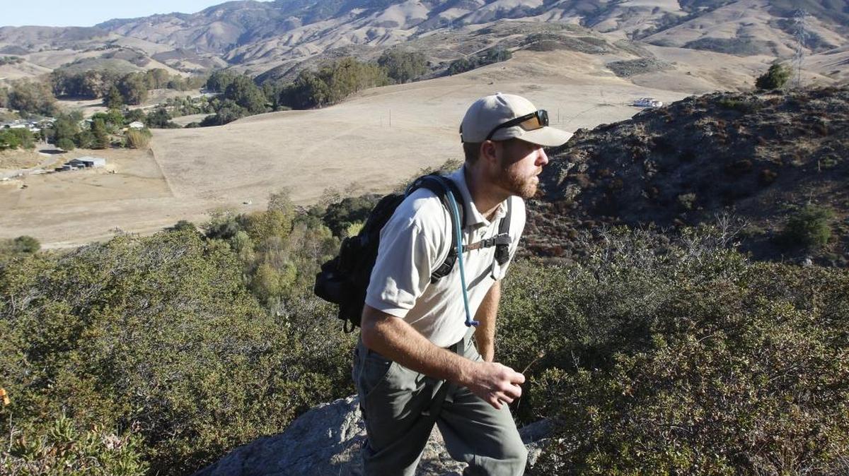 San Luis Obispo Ranger Services Supervisor Doug Carscaden goes on a hike. The city is offering permits for people interested in hiking and biking on Cerro San Luis trails after dark until March.