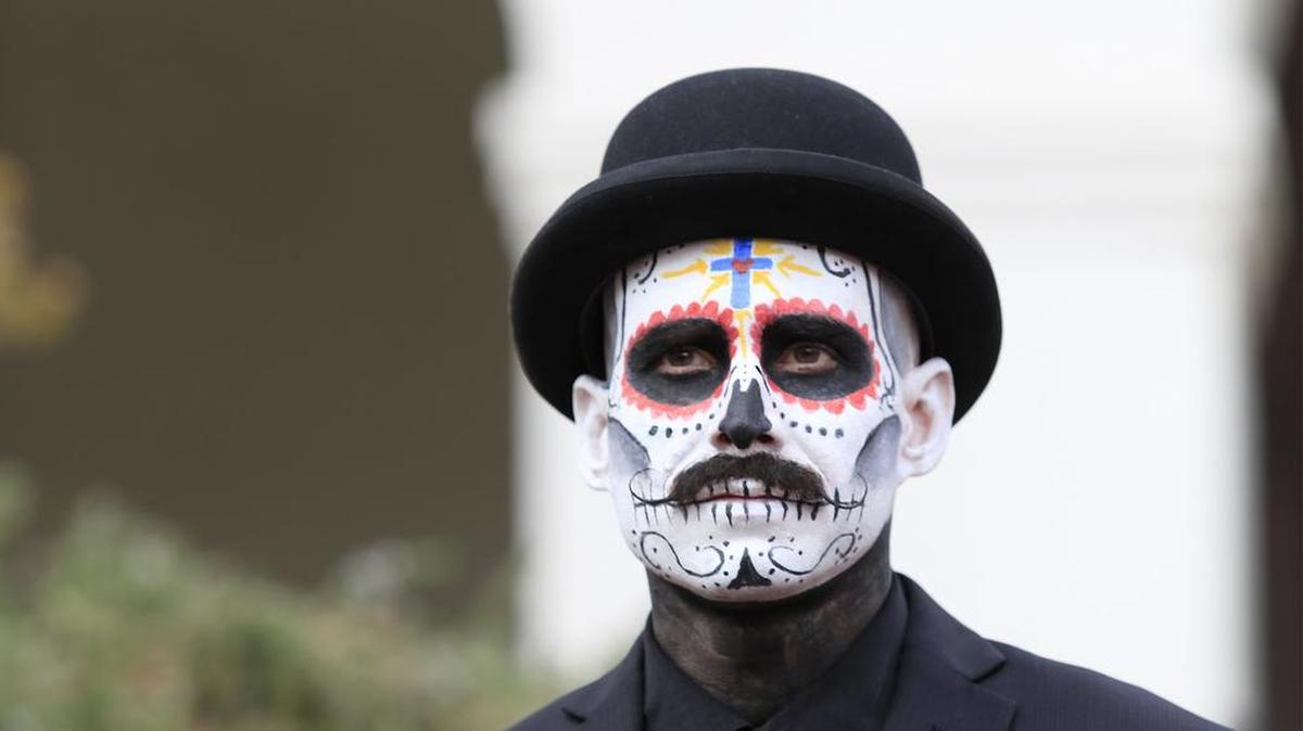 Dia de los Muertos celebration was held at the Mission Plaza, Saturday, November 4, 2017. During the adult portion of the costume contest, Jon Ford, of Arroyo Grande, is dressed as “El Catrin”, waits while the judges huddle.
