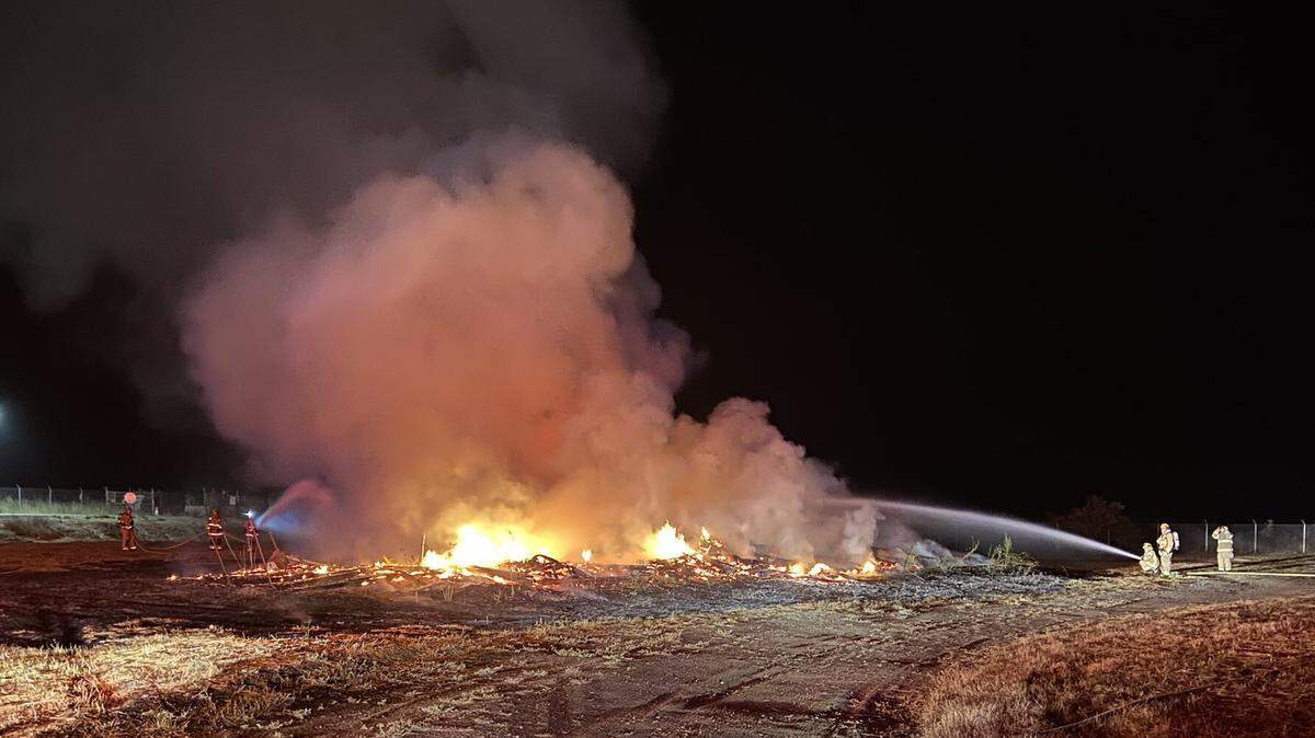 Cal Fire firefighters work to extinguish a structure fire at at Camp San Luis Obispo on Monday night.