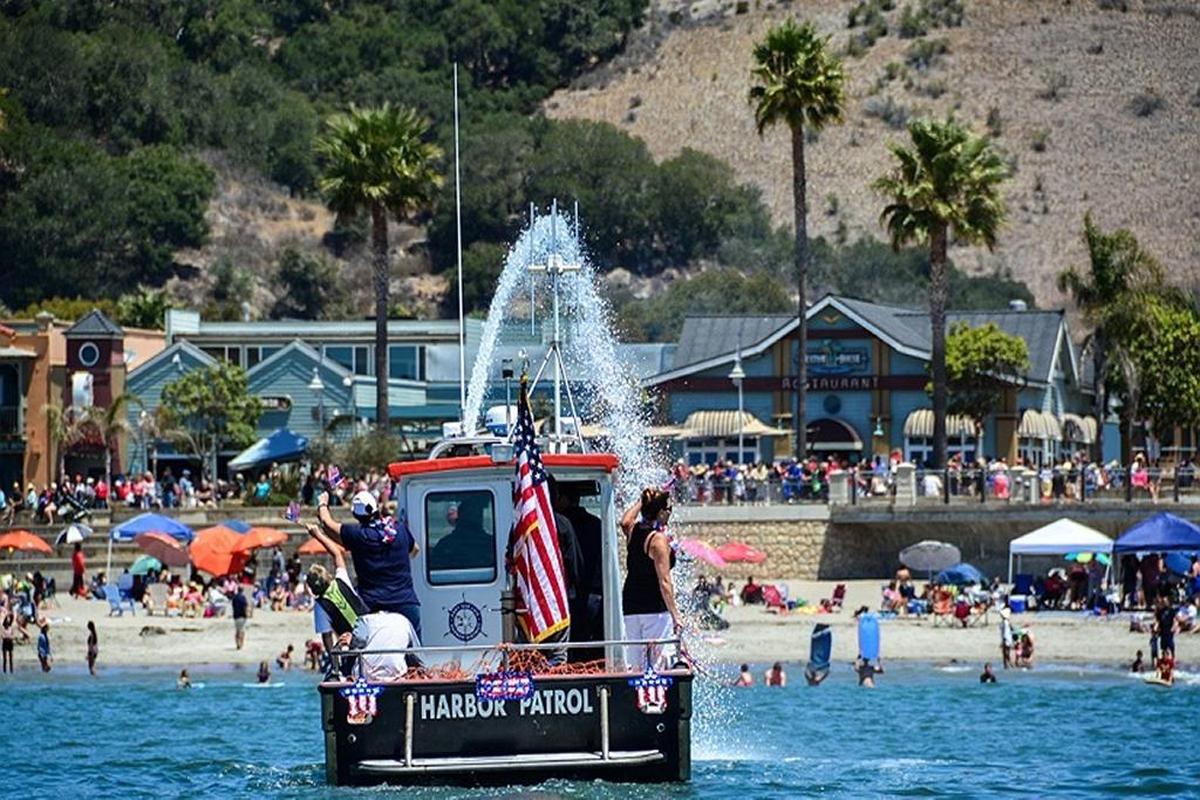The San Luis Yacht Club and the Port San Luis Harbor Patrol team up for a patriotic boat parade in Avila Beach on Tuesday.