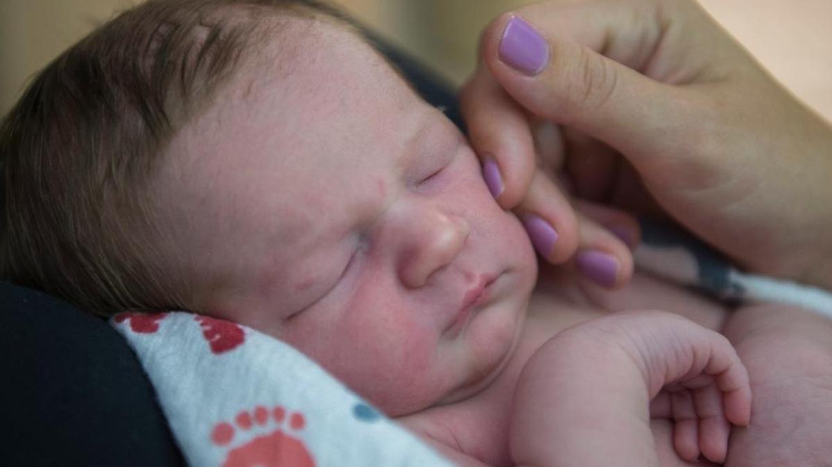Rockland resident Amanda Mackey softly touches the cheek of her son, 1-day-old Beckett Mackey at Sutter Davis Hospital on Aug. 1, 2017, in Davis.