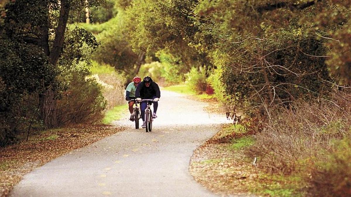 Bicyclists ride along part of the Bob Jones trail in Avila Beach.