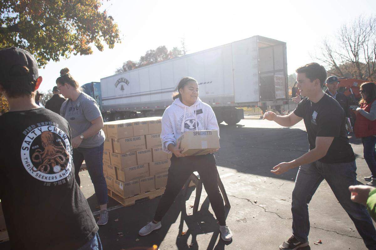 Volunteers from the Church of Jesus Christ of Latter-day Saints unload 24 pallets of food from a semi truck at the Paso Robles location on Tuesday Nov 22, 2022.