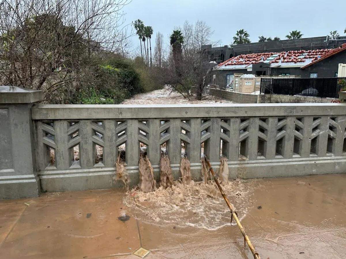 Mission Creek overflowing onto Haley Street in downtown Santa Barbara on Sunday afternoon.