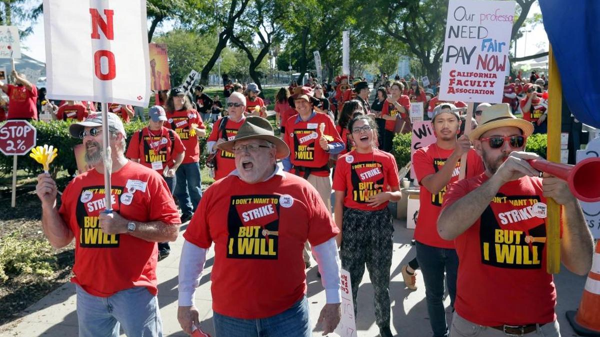 Faculty from campuses all over California are joined by students during a rally Tuesday outside the California State University Board of Trustees meeting at the Chancellor’s office in Long Beach. The faculty are demanding a 5% general salary increase, following a 94.4% strike authorization vote announcement on Nov. 4, 2015. CSU management is offering a 2% salary increase for faculty in the second year of the contract.