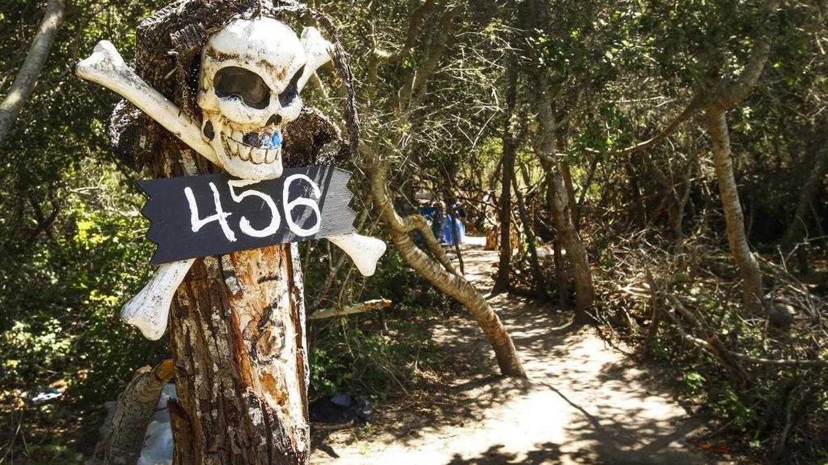 A skull and crossbones marks the entrance to a Grover Beach homeless camp that the city cleared out North Fourth Street this week.