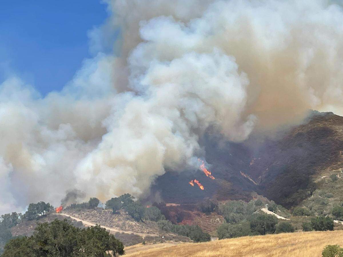 The Camino Fire burns in the hills near Huasna on Tuesday, June 28, 2022, according to Cal Fire. The fire has the potential to reach 1,500 acres.