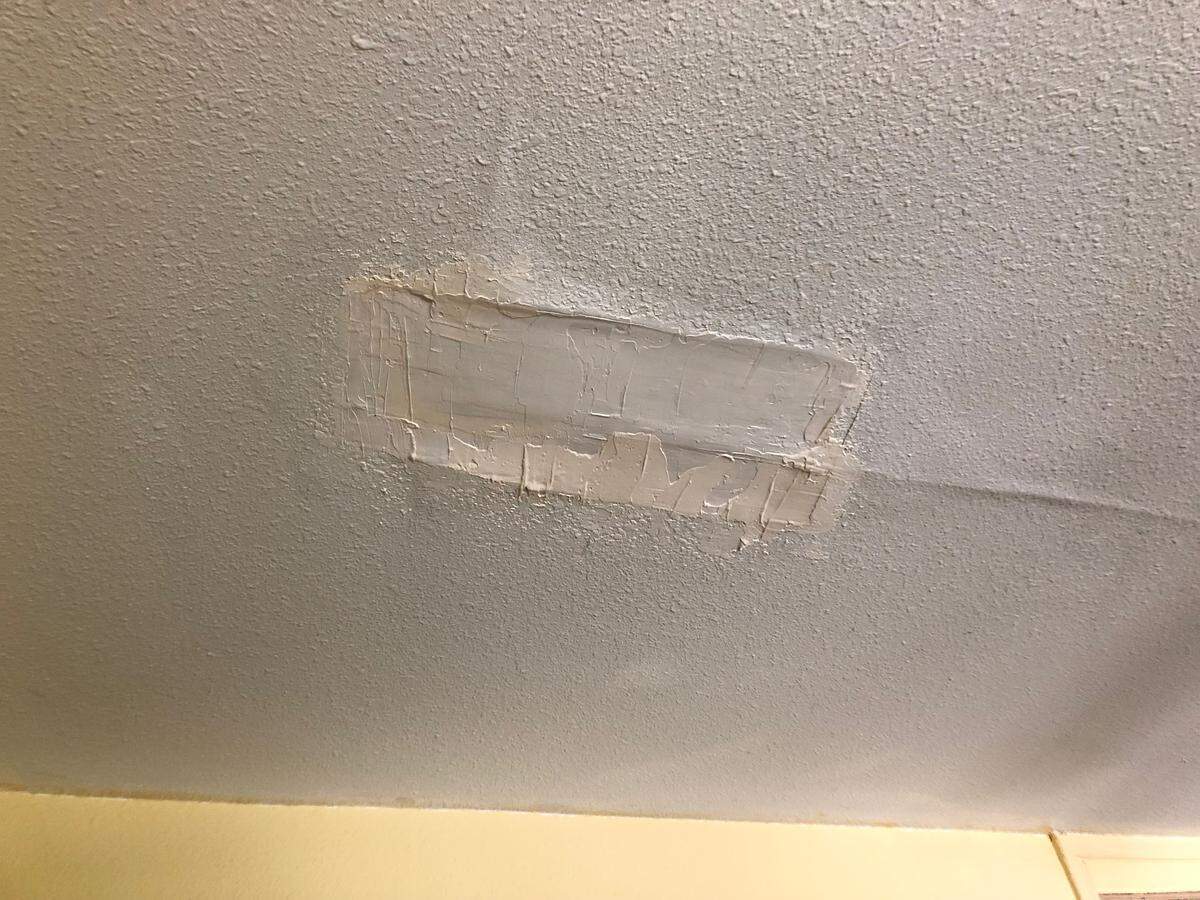 A bedroom ceiling hole a resident’s husband repaired in a unit at the Grand View Apartments complex in Paso Robles.
