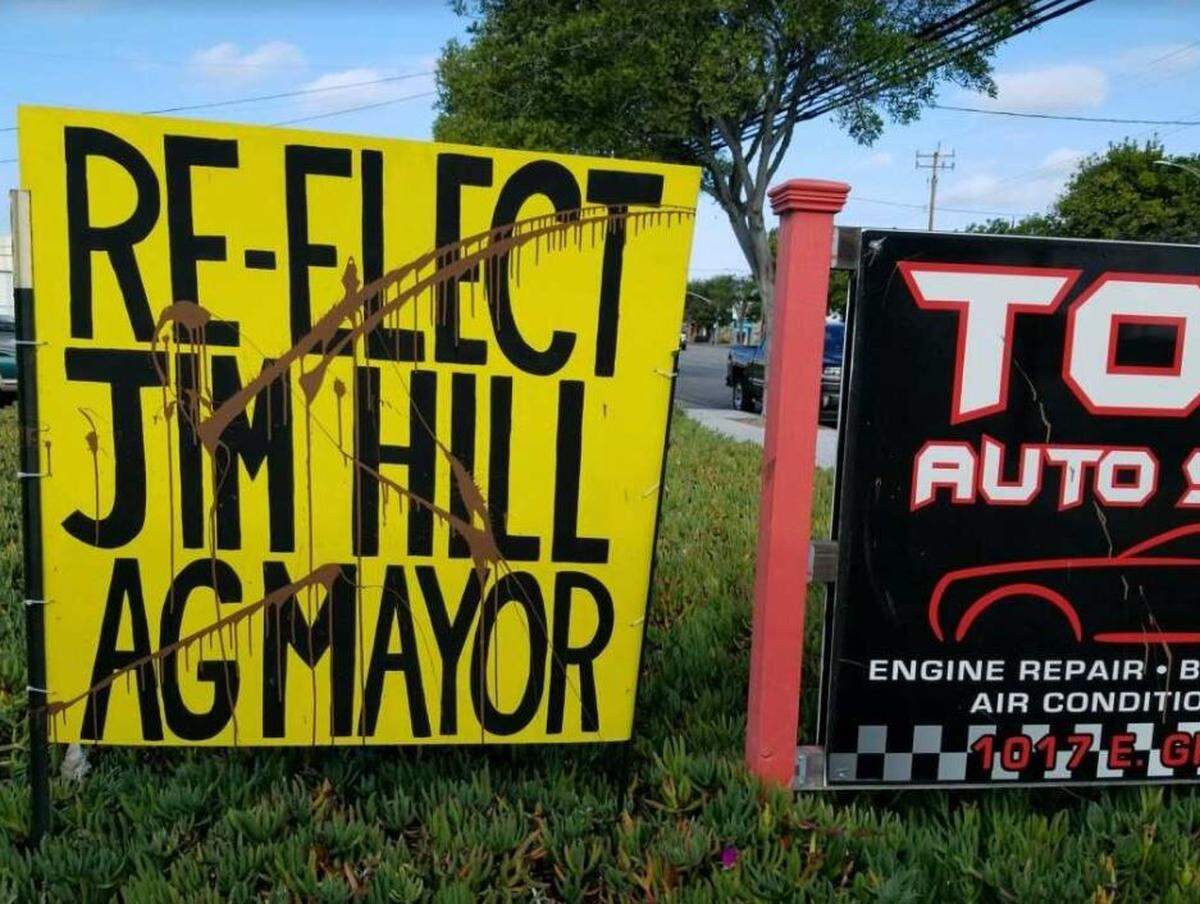 Brown paint defaces one of Arroyo Grande Mayor Jim Hill’s campaign signs in November. Police say about a dozen of his signs were vandalized.