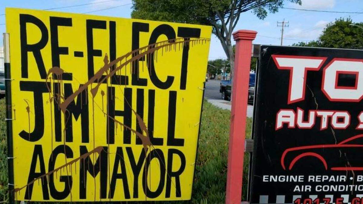 Brown paint defaces one of Arroyo Grande Mayor Jim Hill’s campaign signs in November. Police say about a dozen of his signs were vandalized.