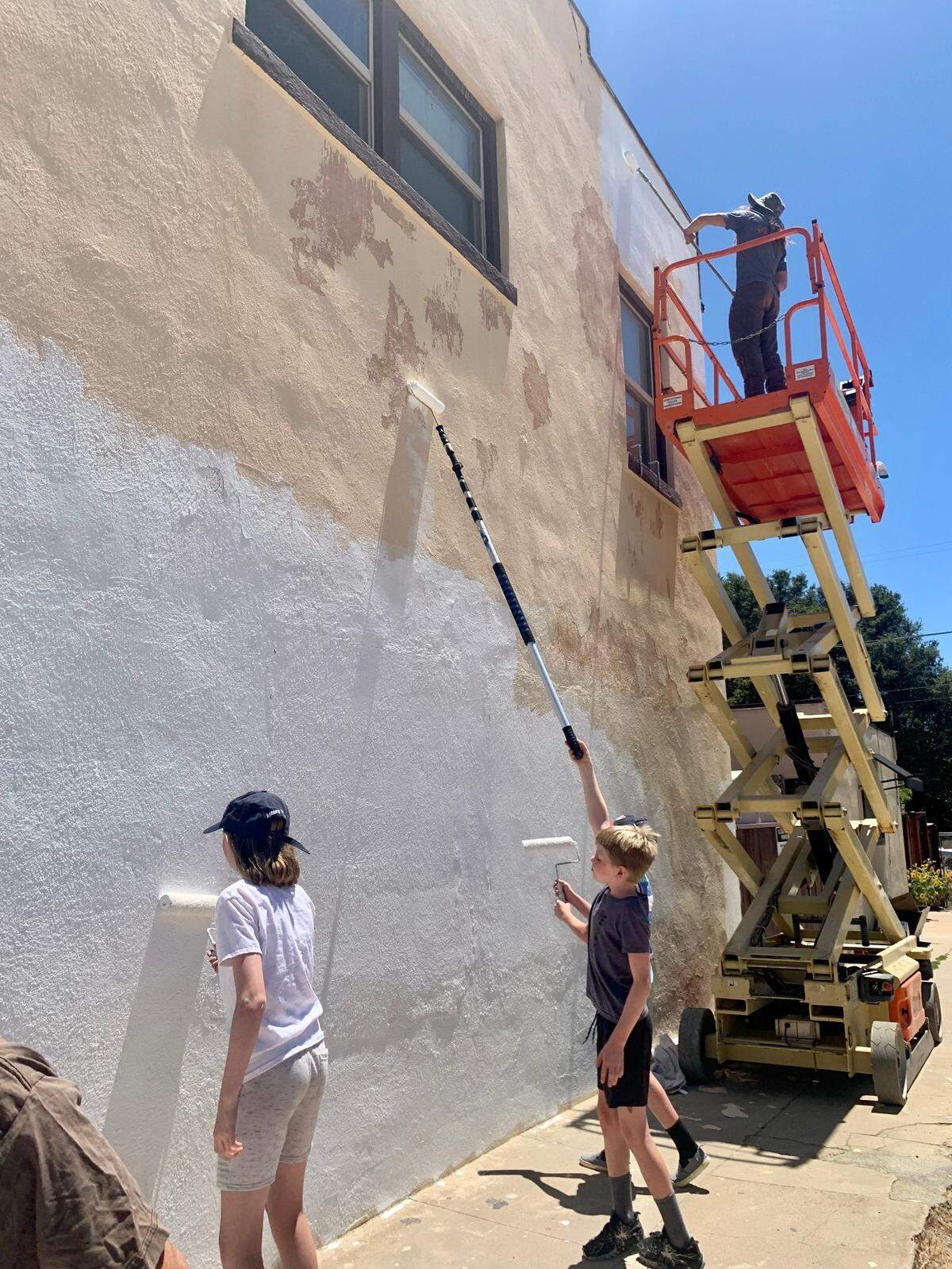 Community members help with the mural “Nature is for Everyone” by artist Brandy Pippin, located in downtown Atascadero.