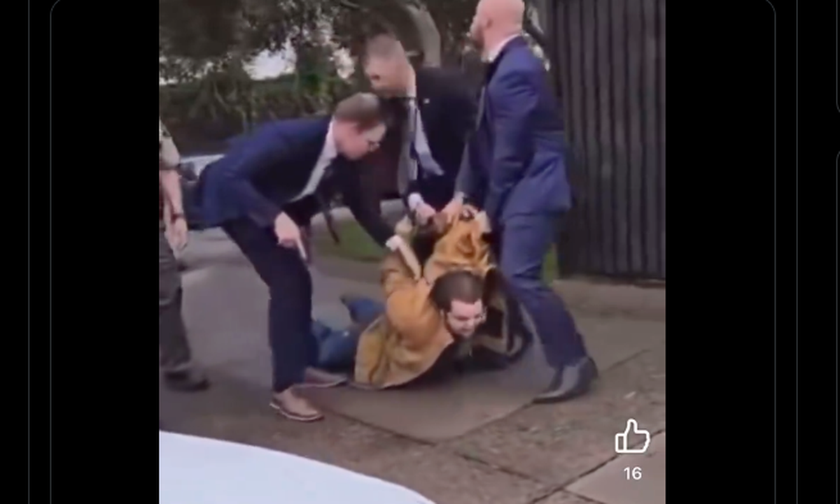A screenshot of a video posted on X shows three men dragging the suspect in a bombing at the Santa Maria Superior Courthouse outside the building on Wednesday, Sept. 25, 2024.