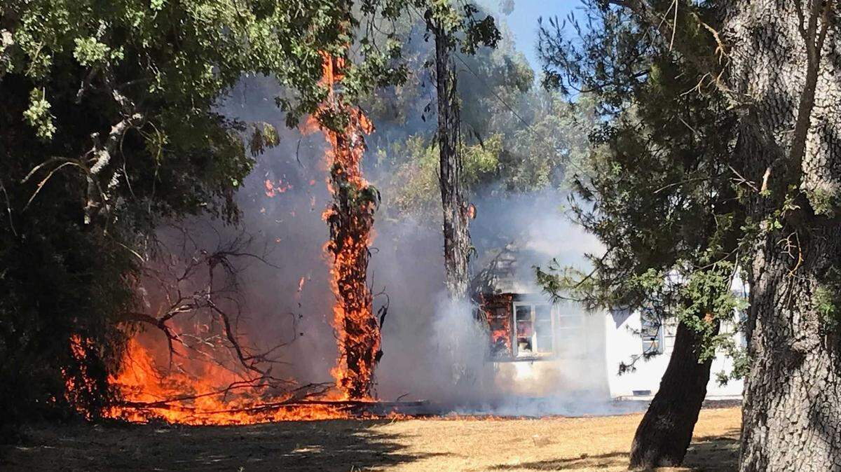 A fire in Atascadero on El Camino Real engulfs a home on Wednesday, July 21, 2021.