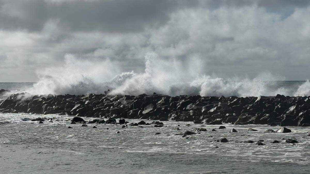 Powerful waves crash over the breakwater in Morro Bay on Saturday, Dec. 30, 2023.