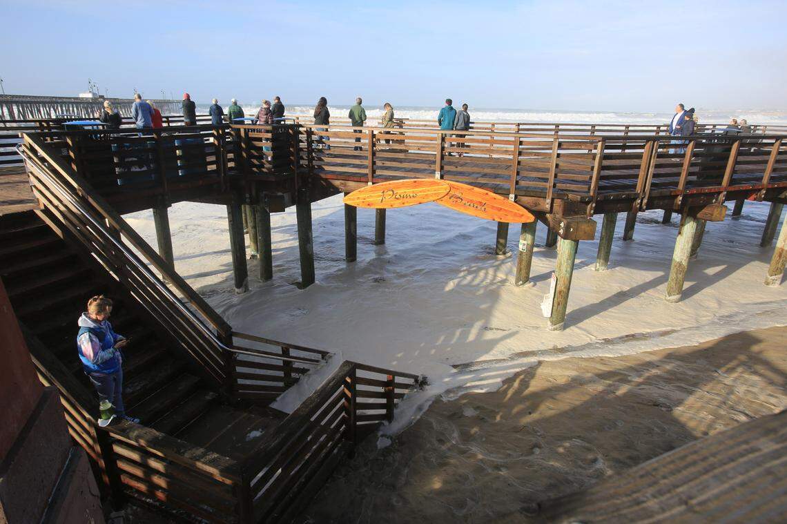 The high tide brought sea foam up to the stairs off the pier in Pismo Beach after a big storm passed through on Jan. 5, 2023.