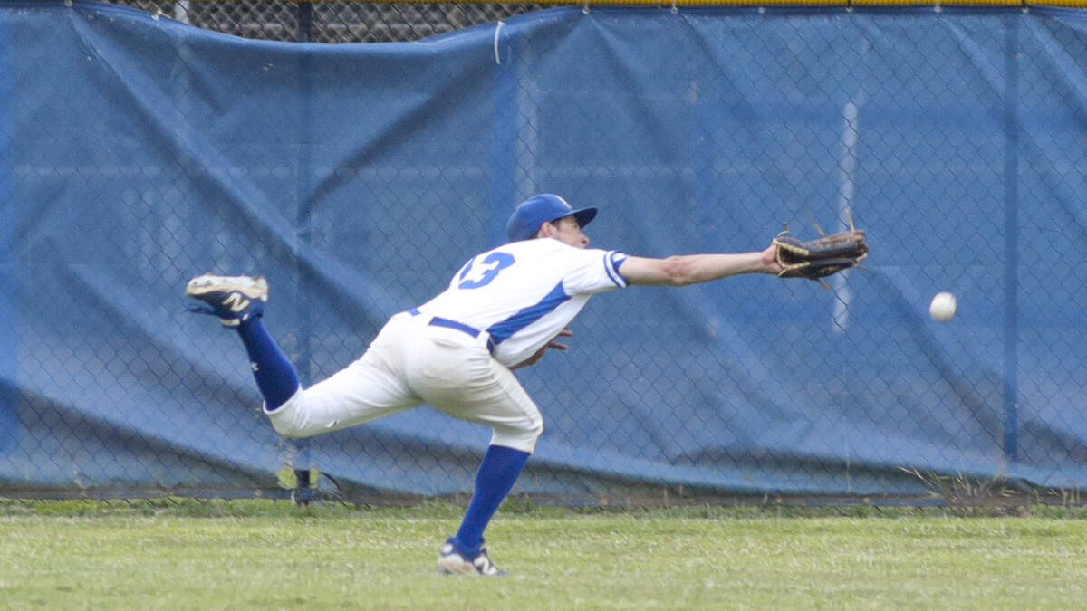 Frankie Ainley makes a dive for a ball just out of his reach. Atascadero won 6-4 in a baseball game against Morro Bay High School May 1, 2025.