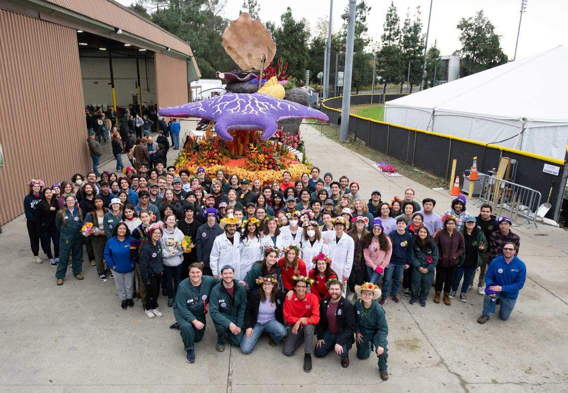 Students from Cal Poly San Luis Obispo and Pomona pose in front of the rose float, which won the Rose Parade’s Crown City Innovator award on Monday, Jan. 1, 2024.