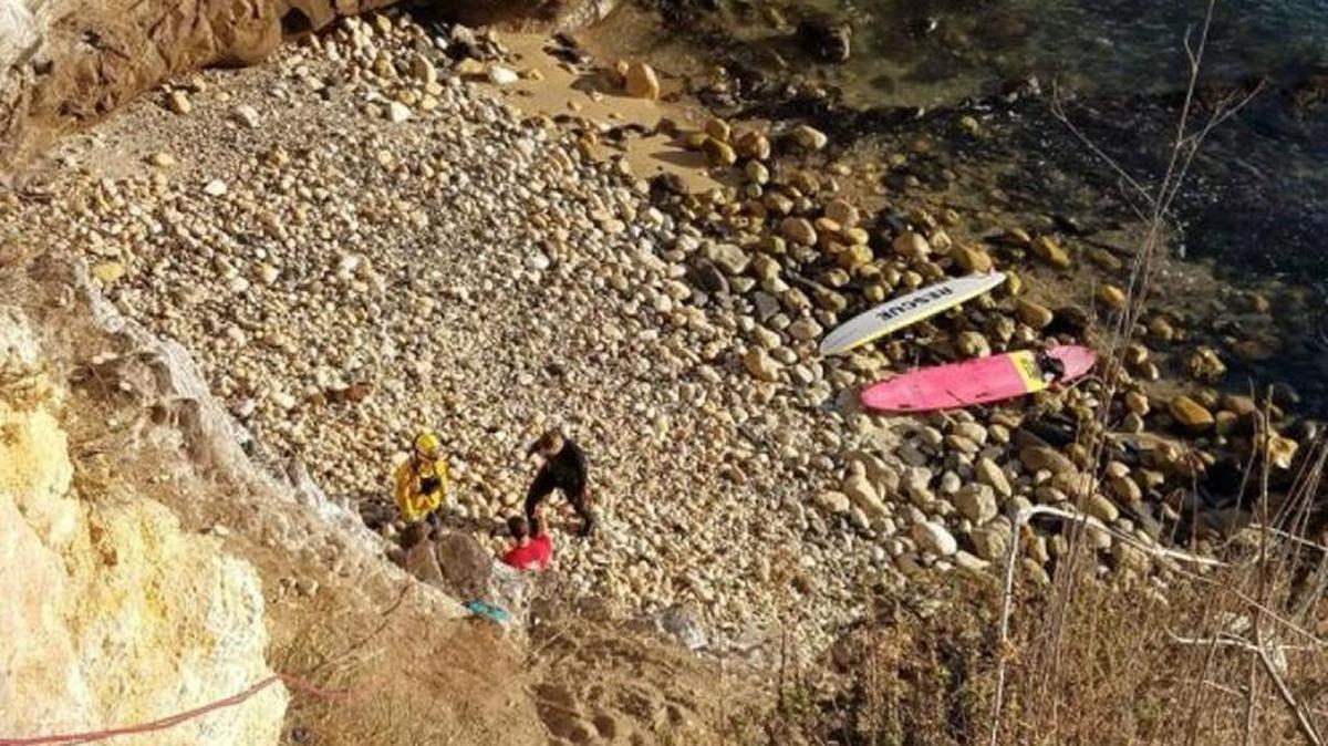 Responders help a climber who got stuck halfway down a cliff near Cave Landing. Crews towed her away from the cliff on a paddleboard and the Port San Luis Harbor Patrol transported her to an Avila Beach pier.