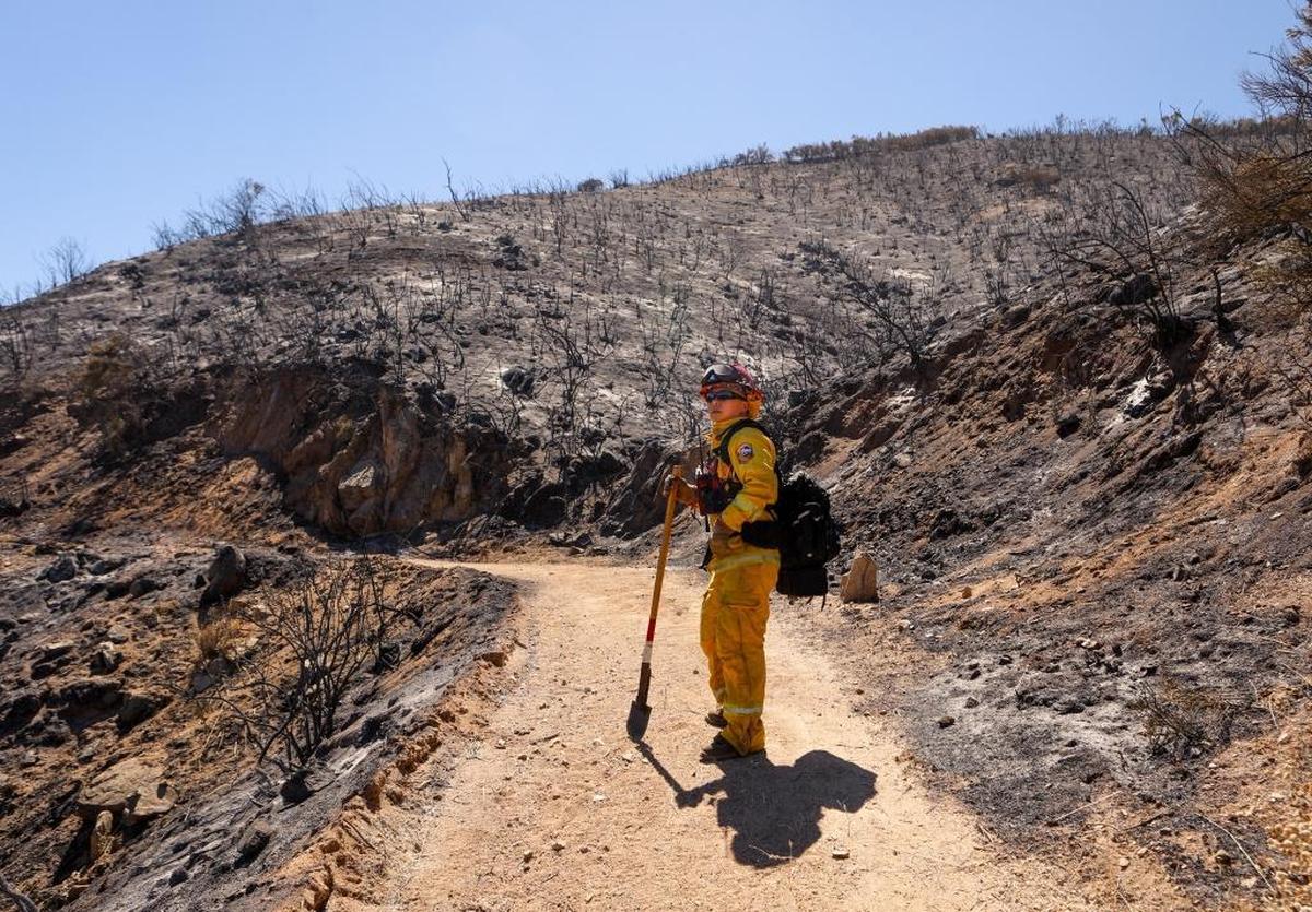 Cal Fire Capt. George Huang, based in Los Osos, takes in the scene of the Hill Fire near Huer Huero Road in Santa Margarita.