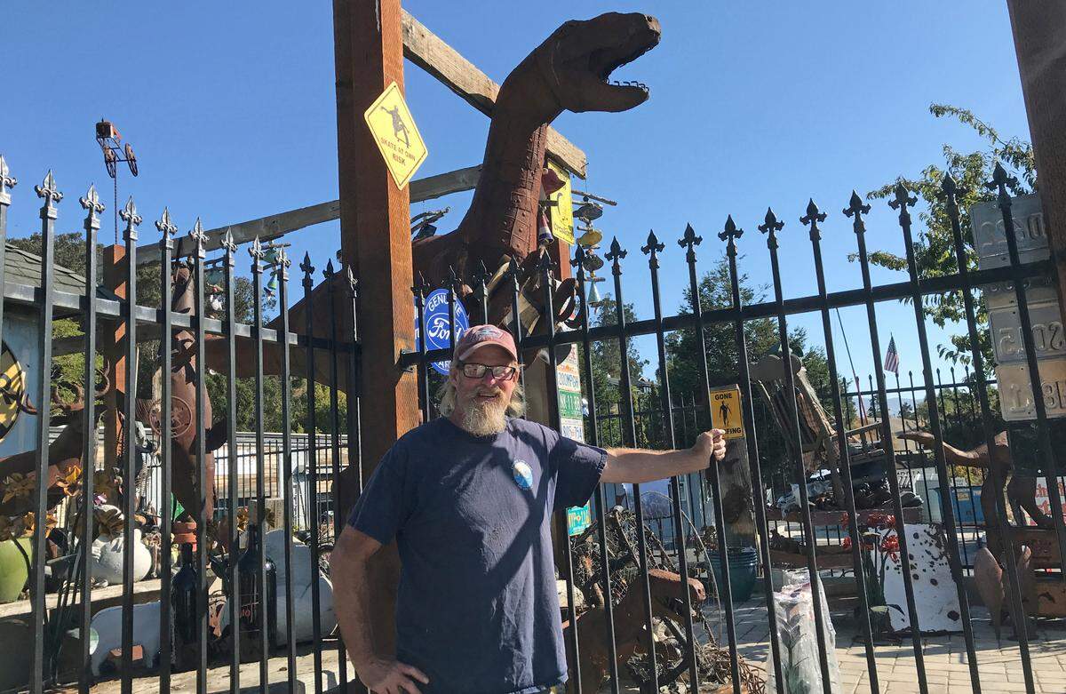 Cambria Garden Arts owner Bill Bookout has assembled a wide assortment of yard decor at 1561 Main St., including various weathered sheet metal dinosaurs.
