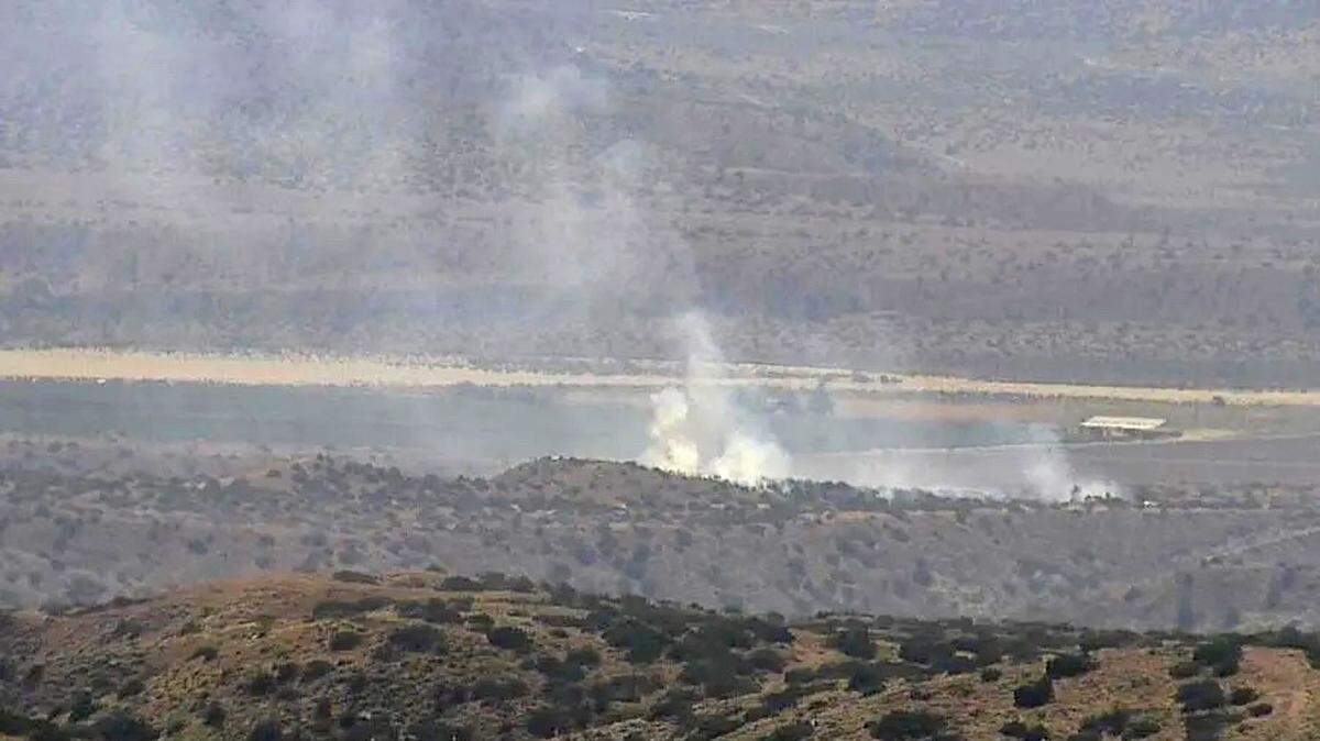 A structure fire spread to nearby vegetation in the Cuyama Valley Friday afternoon.