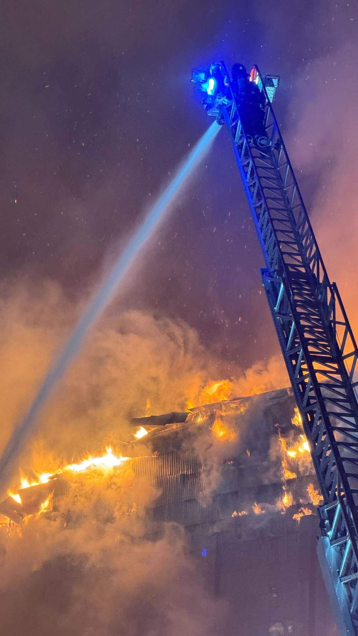 Flames could be seen erupting from an upper floor of Templeton Feed & Grain early July 5, 2025, as firefighters attempted to save the building.&nbsp;