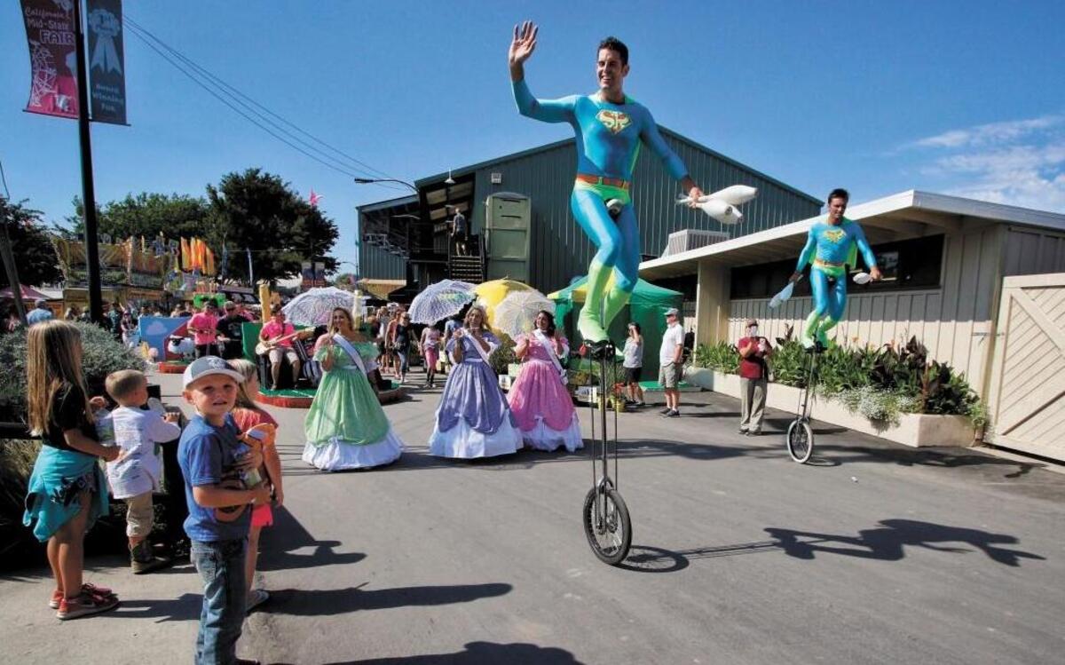 Something Ridiculous leads the Midway Spectacular parade at the California Mid-State Fair in Paso Robles in 2015. The juggling duo performs Friday at the Los Osos library.