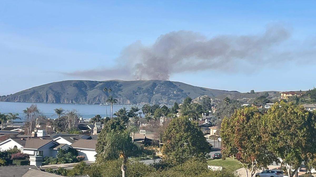 A controlled burn near Diablo Canyon nuclear power plant sends up a column of smoke near over Avila Beach on Friday, Dec. 15, 2023, as seen from Shell Beach.