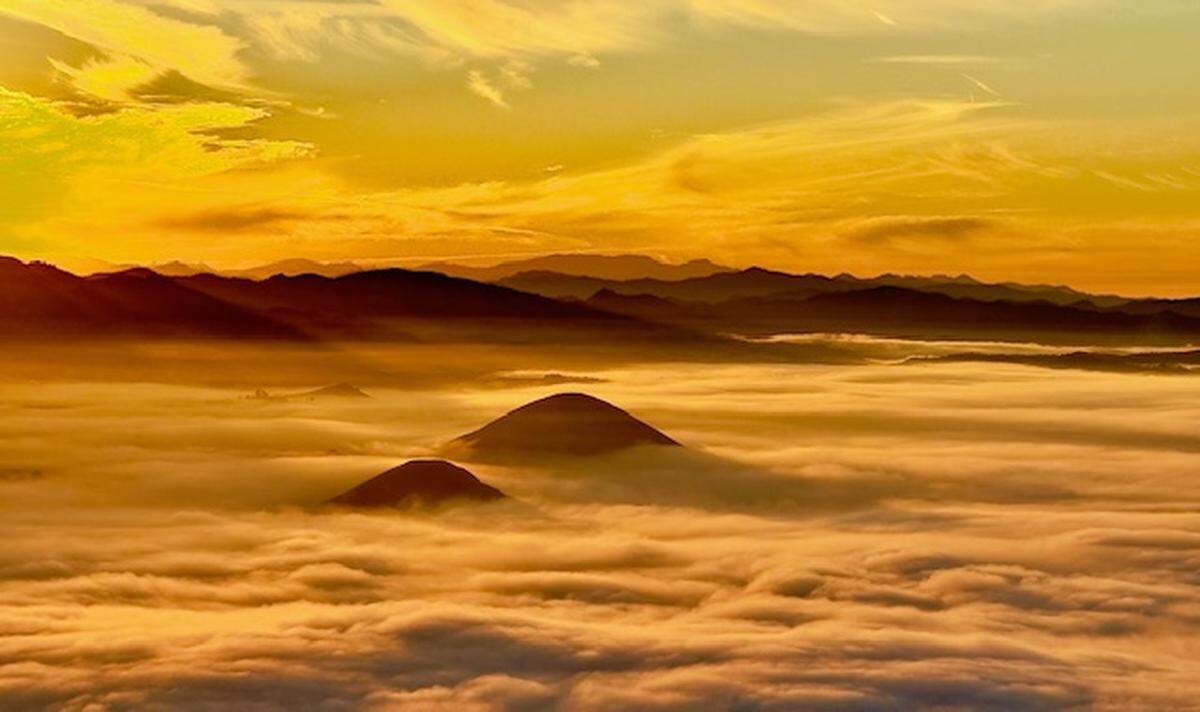 Early morning fog nestles around San Luis Obispo hilltops in a sunrise view from Cerro San Luis on Tuesday, Dec. 3, 2024.