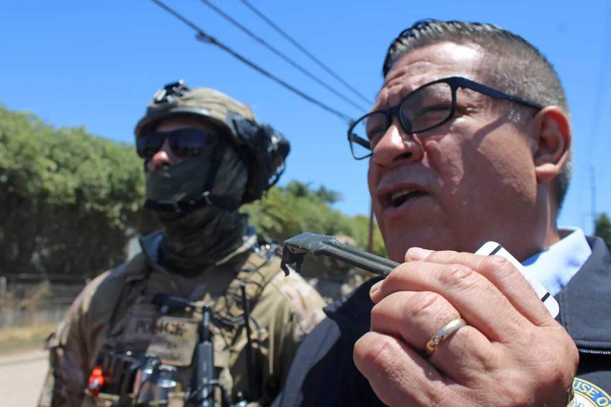 Congressman Salud Carbajal, D-Santa Barbara, holds shrapnel from a flash bomb thrown toward the feet of protesters during a federal immigration enforcement operation on Thursday, July 10, 2025, at a Carpinteria cannabis business. 