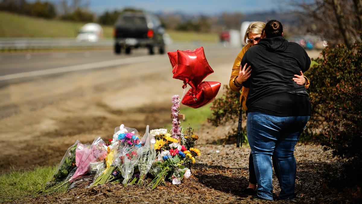Amanda Ruiz, in yellow, hugs family friend Sylvia Rodriguez at a memorial for Amanda’s daughter, Emilee, a 17-year-old from Paso Robles who was hit by a car and killed near the northbound Highway 101 Las Tablas on-ramp on Tuesday, March 5, 2019.