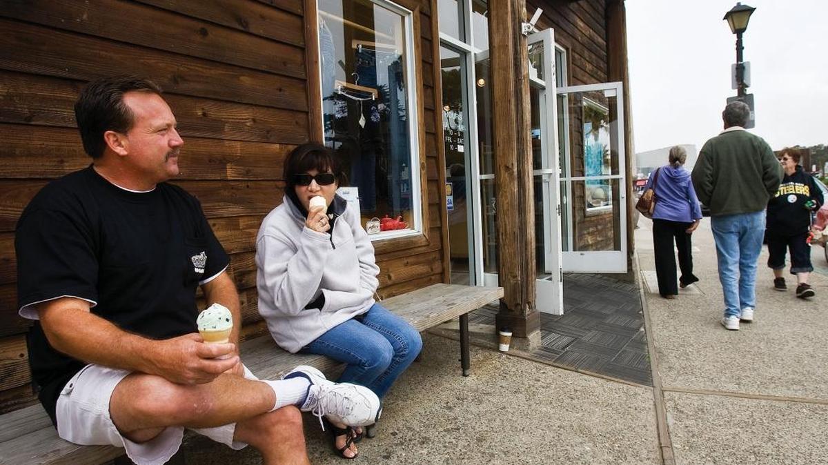 Charles and Monica Cook from Simi Valley enjoy ice cream on the Embarcadero in Morro Bay in a 2009 photo. The city wants to discuss ways to improve visitor flow between the waterfront and downtown.