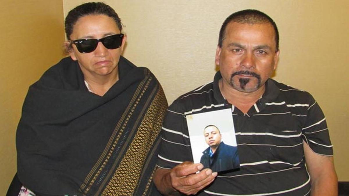 Yolanda Garcia and Javier Garcia Villalobos, the parents of Javier Garcia Gaona, hold his picture during a press conference in Santa Maria on Wednesday. Gaona was fatally shot by Santa Maria police July 20.