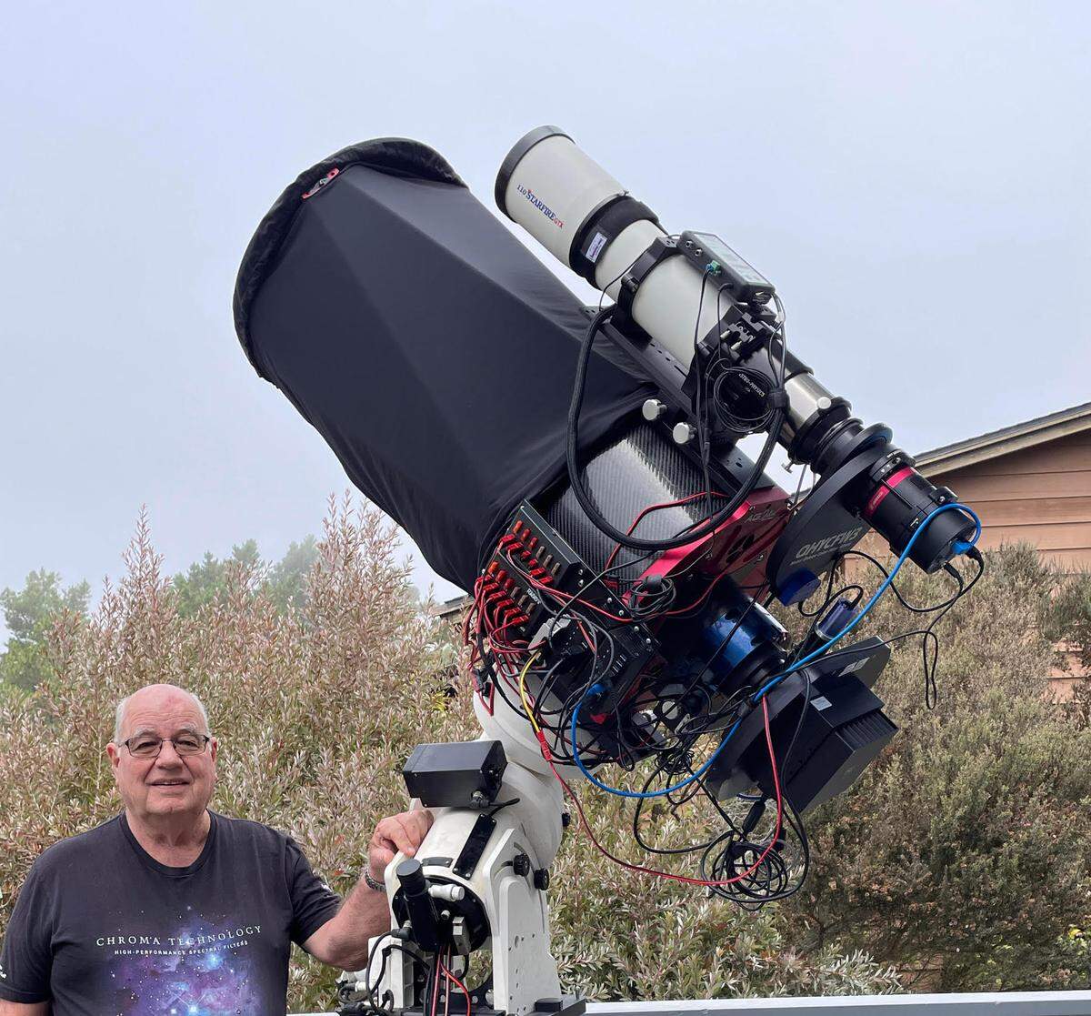 Frank Widmann, astronomer and astrophotographer, uses this  complicated setup to take detailed photos  of deep space. His “studio” is the deck of his Cambria home.