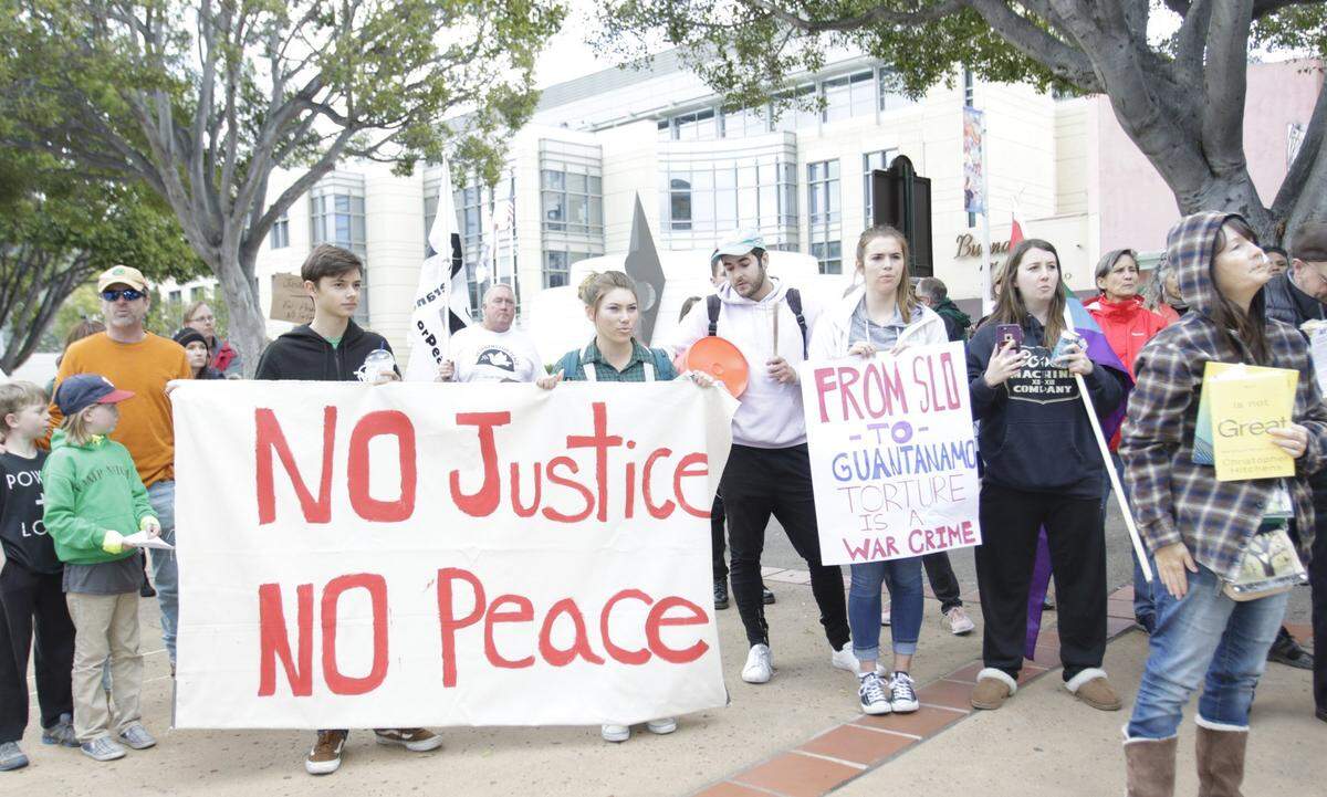 Protesters gather in downtown San Luis Obispo on Saturday to speak out about the death of Andrew Holland in County Jail in January 2017.