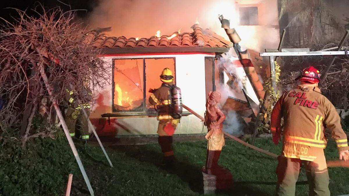 Cal Fire San Luis Obispo and Paso Robles Fire Department fight flames at home between Paso Robles and San Miguel on the night of Thursday, Dec. 27, 2018.