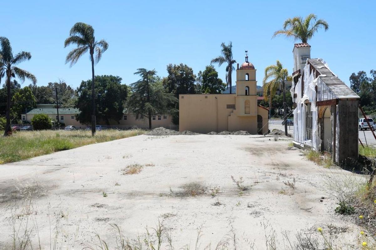A lone facade from the original Motel Inn is propped up by supports on Monterey Street in San Luis Obispo.