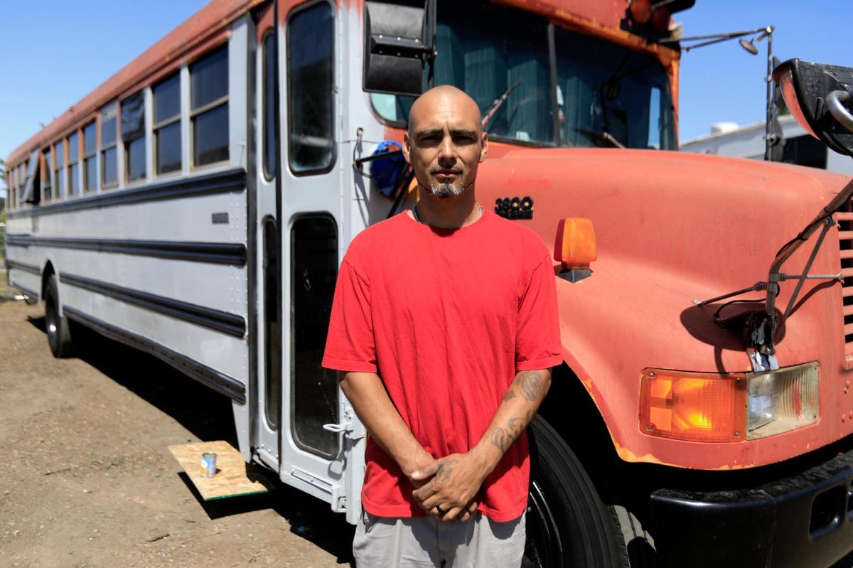 Juan Mejia, his wife and five children are living in a converted bus at the Kansas Avenue safe parking site SLO County created for unhoused residents with vehicles. Mejia was previously parking outside Pismo Beach and Oceano before law enforcement told him to move.