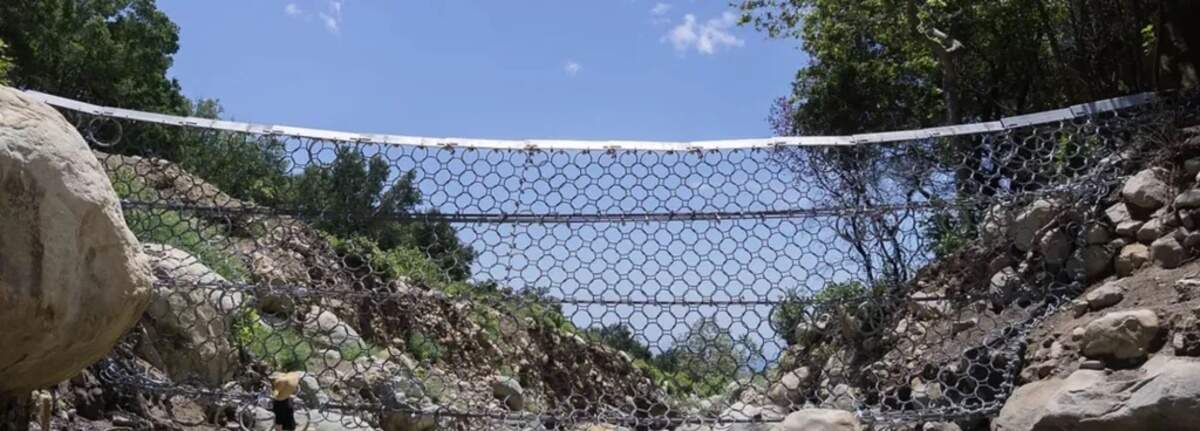 A debris net stretches across San Ysidro Creek in the mountains above Montecito.