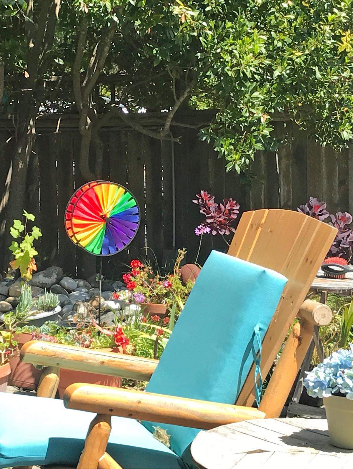 One of several garden spinners twirls colors and joy near a small pond in one of the gardens at columnist Kathe Tanner’s Cambria home.