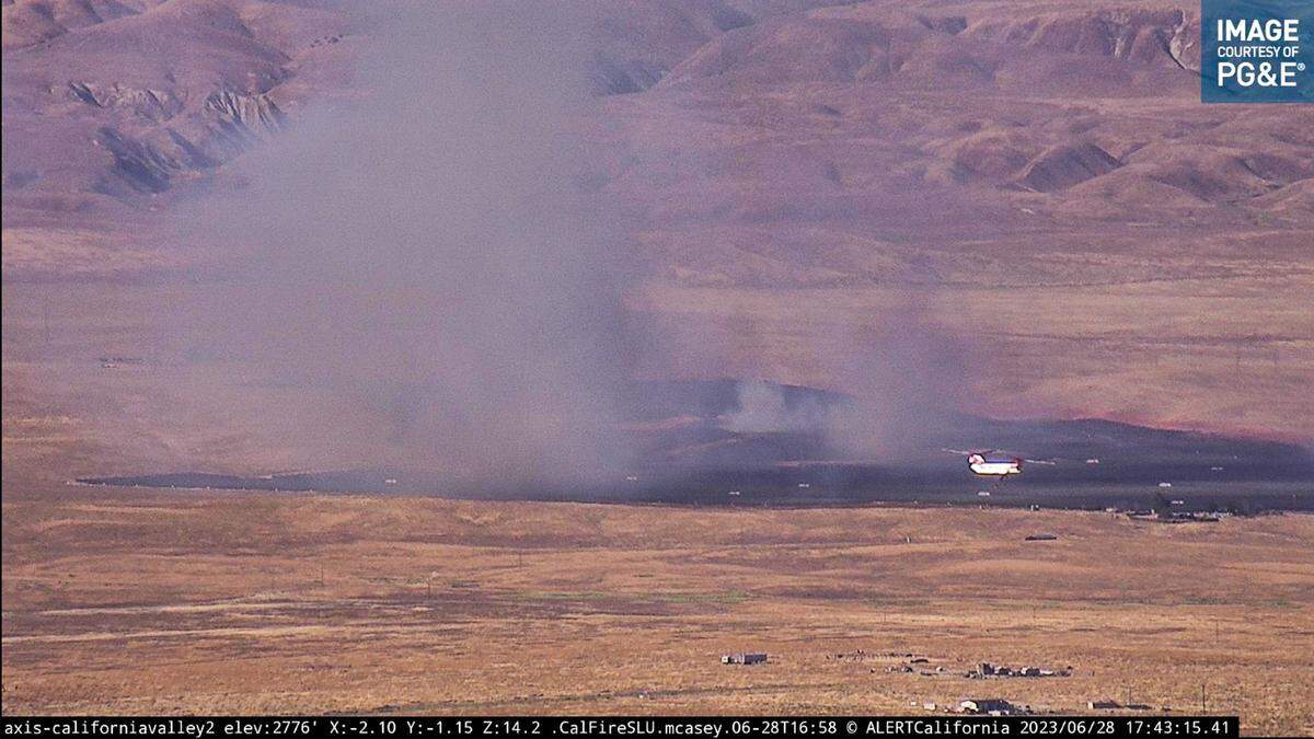 A wildfire burns off Boulder Creek Road on the Carrizo Plain on Wednesday, June 28, 2023.