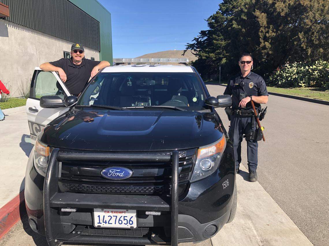 Social worker John Klevins, left, and Tim Koznek, an officer with the San Luis Obispo Police Department, right, go out on regular patrols and meet with homeless.