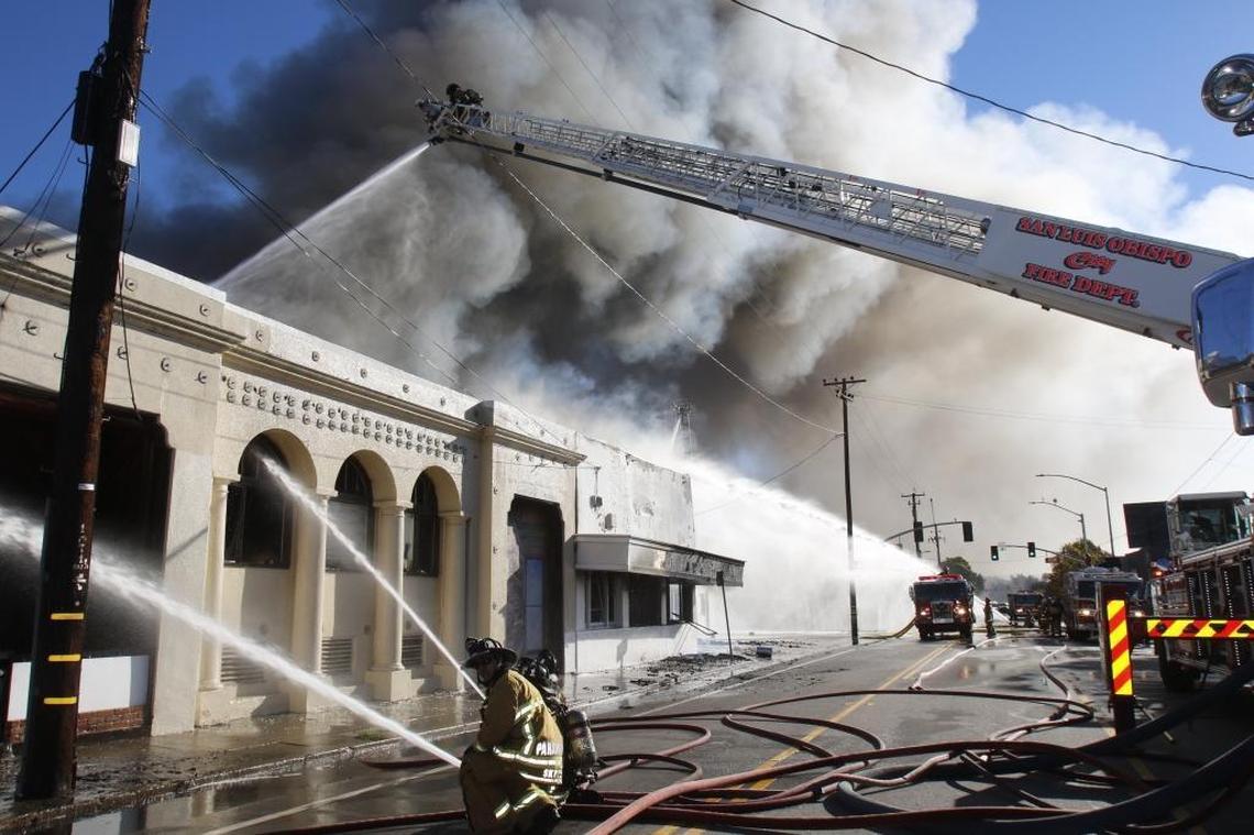 The Sub novelty store on South Higuera Street in San Luis Obispo was destroyed by a December 2015 fire. Here, firefighters battle the stubborn blaze as smoke pours from the roof.