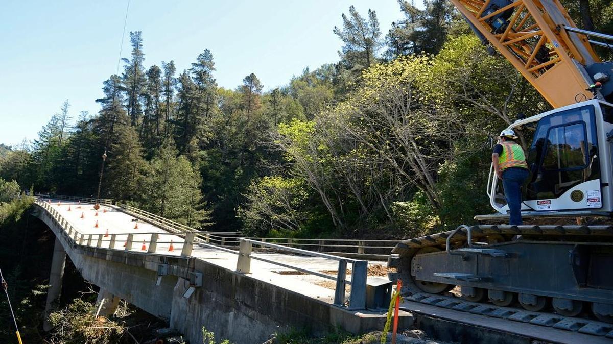 Construction crews attempt to use a wrecking ball to demolish the Pfeiffer Canyon Bridge on Highway 1 on Monday in Big Sur. Work was halted because the wrecking ball was not generating enough force.