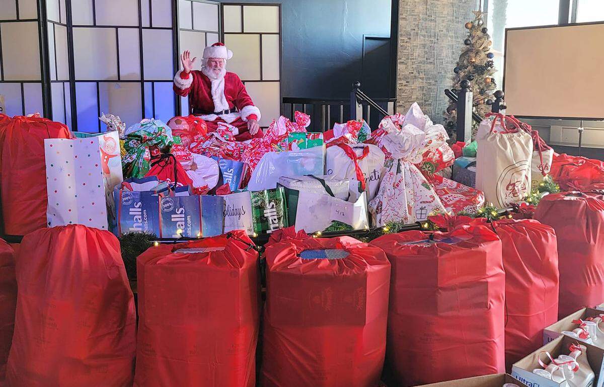 Tom Tierney of Cambria prepares for the big giveaway of toys, food and more to about 220 children and their families in San Simeon.